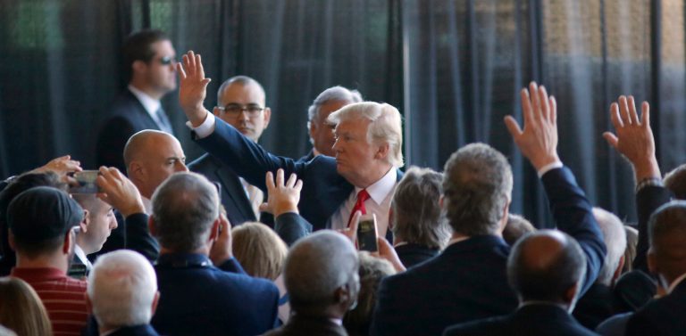 President Donald Trump waves to Boeing employees, Friday, Feb. 17, 2017, in the final assembly building at Boeing South Carolina in North Charleston, S.C. The president visited the plant where Boeing rolled out the first 787-10 Dreamliner aircraft from its assembly line. (AP Photo/Mic Smith)