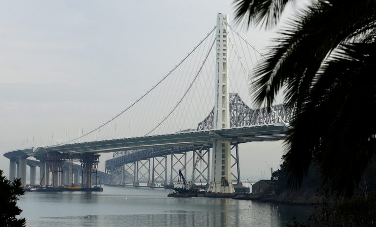 FILE - In this Jan. 7, 2014, file photo, work continues on the new eastern span of the San Francisco Oakland Bay Bridge in San Francisco. A Senate investigative report released Thursday, July 31, 2014, finds senior officials overseeing construction of the $6.5 billion eastern span of the bridge repeatedly and deliberately brushed off criticism about construction problems and sought to keep information secret as part of an 