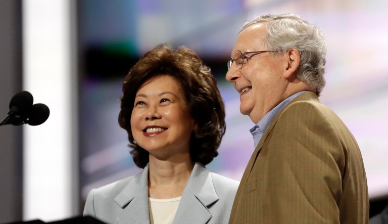 Senate Majority Leader Mitch McConnell, R-Ky., joined by his wife, former Labor Secretary Elaine Chao, checks out the stage during preparation for the Republican National Convention inside Quicken Loans Arena, Sunday, July 17, 2016, in Cleveland.