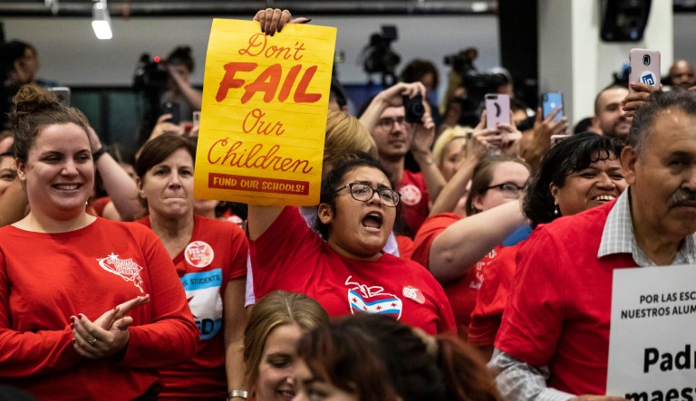 In this Sept. 14, 2019 photo supporters cheer at the Chicago Teachers Union headquarters, in Chicago.