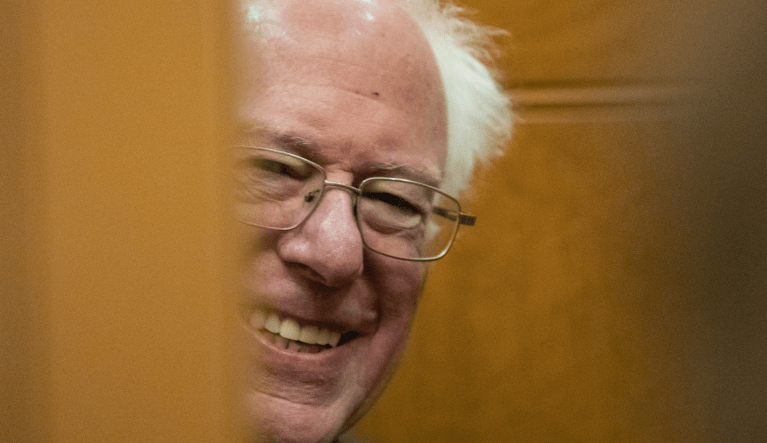 Sen. Bernie Sanders, I-Vt., smiles at a reporter's question as the elevator door closes on Capitol Hill, Monday, Feb. 3, 2020 in Washington. (AP Photo/Alex Brandon)