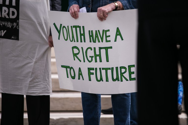 Demonstrators takes part in a rally outside the US Supreme Court, Monday, October 29, 2018, in support of Juliana vs U.S., lawsuit on behalf of 21 youth plaintiffs arguing the government has violated constitutional rights for more than fifty years by contributing to climate change. 