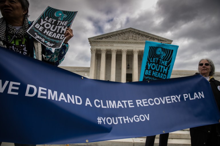 Demonstrators takes part in a rally outside the US Supreme Court, Monday, October 29, 2018, in support of Juliana vs U.S., lawsuit on behalf of 21 youth plaintiffs arguing the government has violated constitutional rights for more than fifty years by contributing to climate change. 