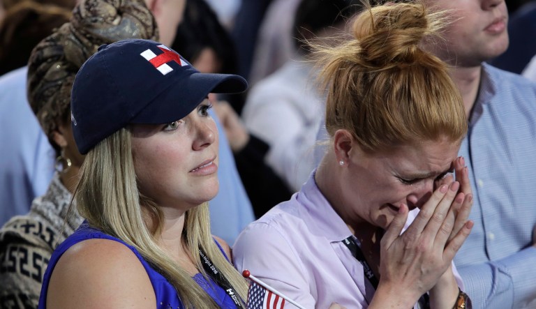 A woman weeps as election results are announced during Democratic presidential nominee Hillary Clinton's election night rally in the Jacob Javits Center glass enclosed lobby in New York, Tuesday, Nov. 8, 2016.