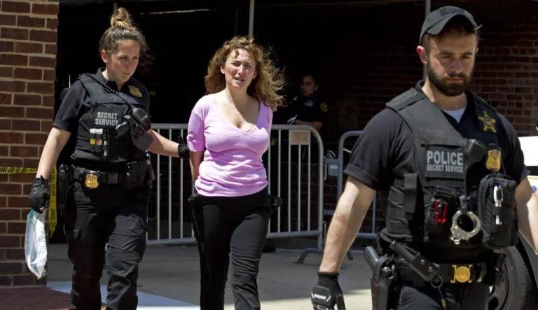 Code Pink member Ariel Gold is arrested.