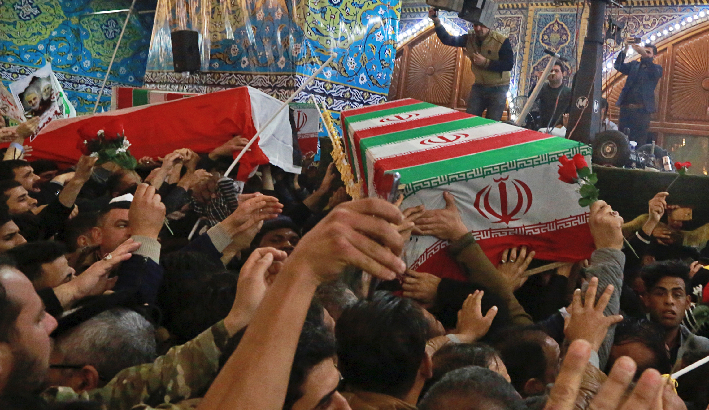 WATCH: Soleimani cardboard coffin flies coach to Iran in cabin of passenger jet