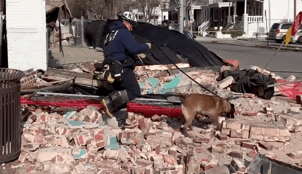 WATCH: Camera captures moment pedestrians narrowly avoid building collapse