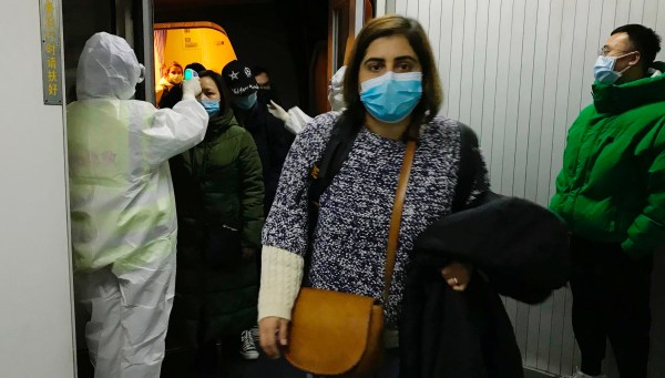 WATCH: Doctors in hazmat suits treat patients with deadly coronavirus