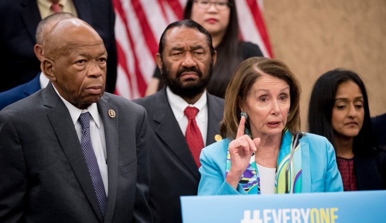 House Minority Leader Nancy Pelosi of Calif., accompanied by Rep. Elijah Cummings, D-Md., left, and others, speaks at a news conference on Capitol Hill in Washington, Tuesday, May 8, 2018. 
