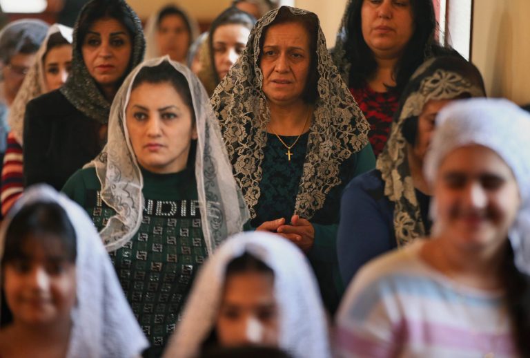 Assyrian Christian women attend Mass marking the traditional Palm Sunday procession at the Assyrian church east of Beirut, Lebanon, Sunday, March 29, 2015. (AP Photo)Â 