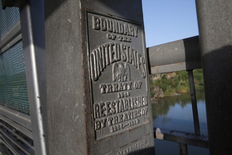 A marker over the Rio Grande River notes the border between the United States and Mexico on April 11, 2013 in Hidalgo, Texas. (Photo by John Moore/Getty Images)