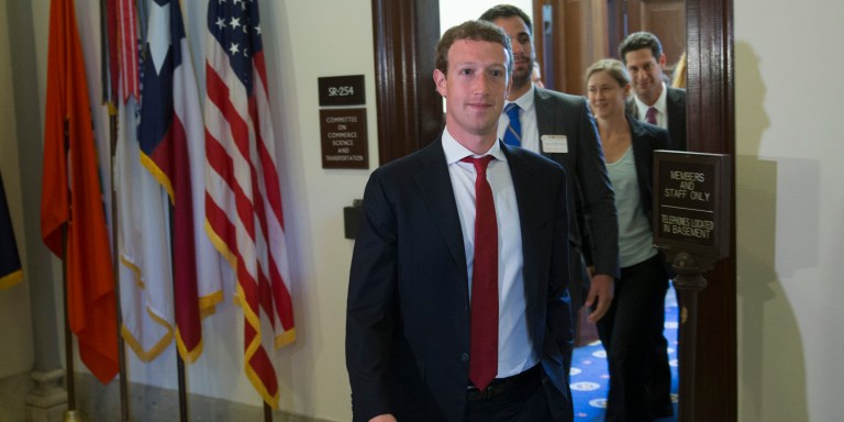 Mark Zuckerberg, founder and chief executive officer of Facebook Inc., leaves a meeting with members of the Senate Committee on Commerce, Science and Transportation in Washington, D.C., U.S., on Thursday, Sept. 19, 2013. Zuckerberg in April announced the formation of an advocacy group, Fwd.us, to push for more visas for skilled immigrant workers. He pressed that cause yesterday in a meeting with Senator Charles Schumer, a New York Democrat. Photographer: Andrew Harrer/Bloomberg via Getty Images