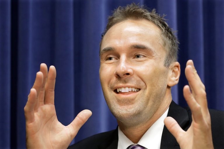 In this Sept. 15, 2014 photo, Chad Grimm, the Libertarian candidate for Illinois governor, speaks with The Associated Press during an interview at the state Capitol in Springfield, Ill. Grimm says he knows he has little chance to win in the November election, but he just might be the guy who decides who does. (AP Photo/Seth Perlman)