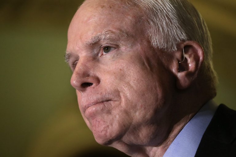 Sen. John McCain, R-Ariz., speaks with members of the Republican leadership about the Defense Authorization Bill following caucus luncheons at the U.S. Capitol June 9, 2015 in Washington. (Photo by Win McNamee/Getty Images)