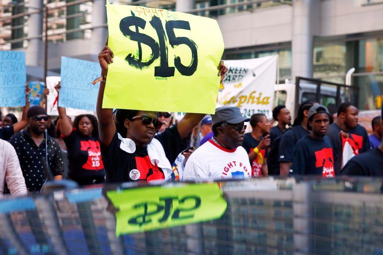 FILE - In this Sept. 4, 2014 file photo, protestors demonstrate to push fast-food chains to pay their employees at least $15 an hour, in Philadelphia. Employers in the United States are hiring at a brisk pace. Unemployment has sunk to a nearly healthy rate. Jobs are being filled across a range of industries. Yet the September jobs report released Friday, Oct. 3, 2014 contained a puzzling fact: Paychecks still aren't growing. Economists regard stagnant wages as a red flag for the 5-year-old recovery. Robust job growth has typically fueled rising wages. And without higher pay, workers have less money to spend and save, and that, in turn, keeps the economy from strengthening further. (AP Photo/Matt Rourke)