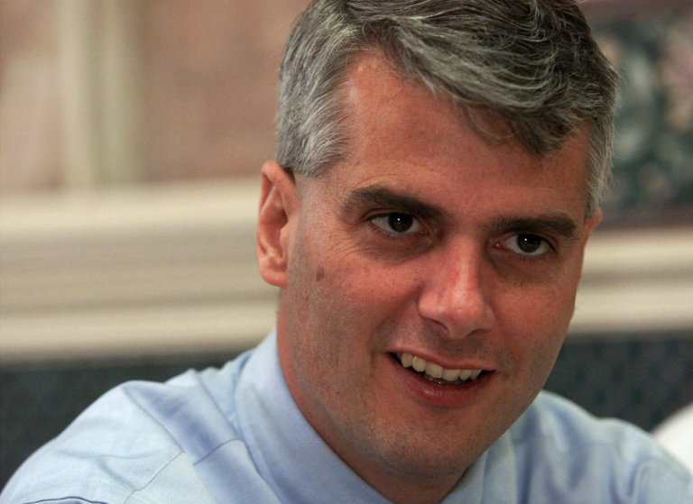 FILE - In a Tuesday, April 12, 2000 file photo, David McIntosh listens during a meeting with elected county officials in Corydon, Ind., as he campaigned in southern Indiana. Three open congressional seats and a strong rematch from 2010 have led to crowded primaries on Indiana's May 8 primary ballot. (AP Photo/Michael Conroy, File)