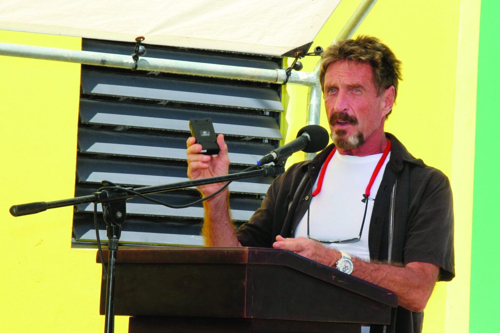McAfee blogs about police seeking him in Belize