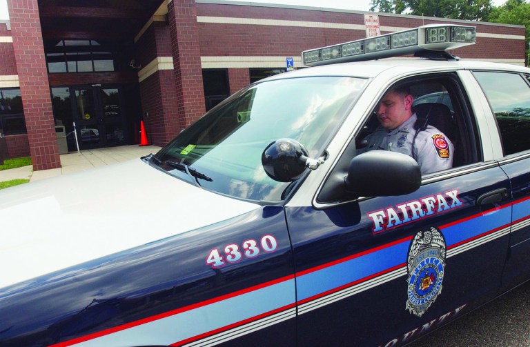 Jeff Mankie/Examiner
Fairfax County Police Officer Tim Schulz outside the Franconia Police Station on Thursday, August 17, 2006.  Schulz is three years out of the county's police academy which has found recruiting to be tougher with competition from federal, state, and other local departments employing law enforcement.