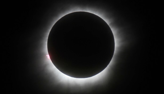 The eclipse will happen during the middle of the day, "when millions are on American roads, potentially causing one of the largest driver distractions in years," according to the FHA. (AP Photo, File)