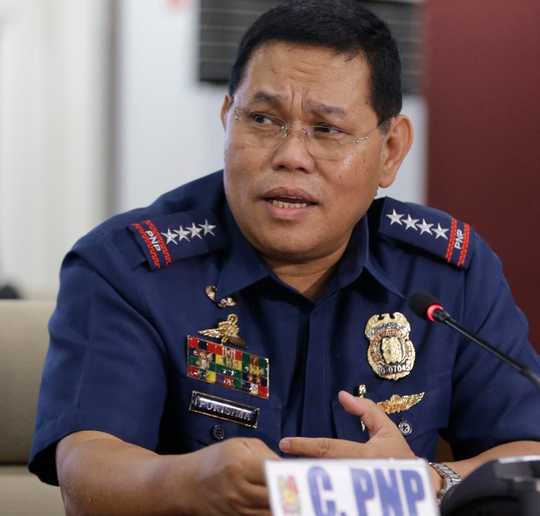 Philippine National Police chief Allan Purisima addresses the media during a news conference on the police' arrest of Chinese fishermen at one of the disputed Shoals, the Half Moon Shoal, off the South China Sea Thursday, May 8, 2014 at the police headquarters in Quezon,  northeast of Manila, Philippines. Purisima said the government will investigate 11 arrested Chinese fishermen if they illegally entered the country or committed other crimes, ignoring China's demand for them to be immediately freed. China pressed the Philippine government Thursday to immediately release the fishermen and their boat, warning Manila not to take any more 