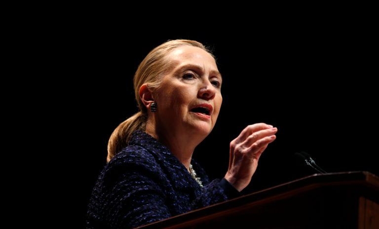   Secretary of State Hillary Rodham Clinton gestures as she gives a speech: 