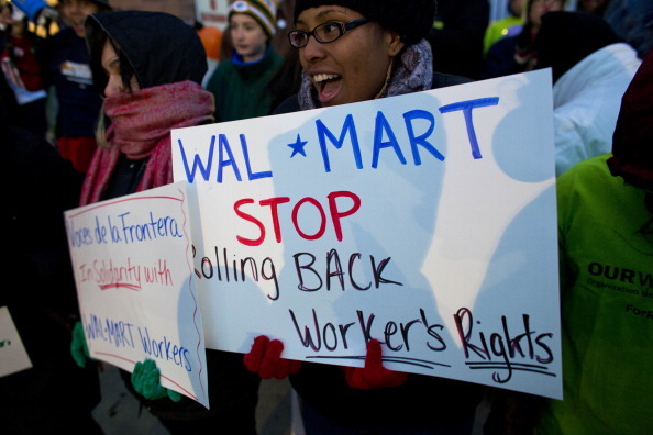 MILWAUKEE, WI - NOVEMBER 23: Workers and supporters march outside a local Wal-Mart retail store on Black Friday November 23, 2012 in Milwaukee, Wisconsin.  The protestors were calling for better wages and working conditions for the employees.  (Photo by Darren Hauck/Getty Images)