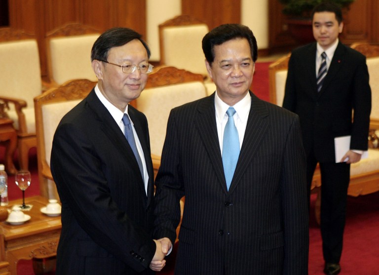 Chinese State Councilor Yang Jiechi, left, and Vietnamese Prime Minister Nguyen Tan Dung pose for photos before their meeting in Hanoi, Vietnam on Wednesday June 18, 2014. Talks between Yang Jiechi and Vietnamese officials on produced no breakthrough in the impasse over an increasingly bitter confrontation in the disputed South China Sea, a Vietnamese official said. (AP Photo/Tran Van Minh.)