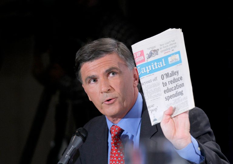 Maryland Republican gubernatorial candidate, former Gov. Robert Ehrlich, holds up a newspaper during his debate with Gov. Martin O'Malley, Thursday, Oct. 14, 2010, in Washington. (AP Photo/Pablo Martinez Monsivais)