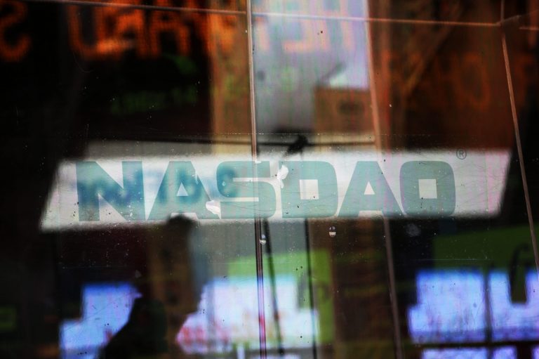   Electronic billboards are reflected in the windows of Nasdaq in New York, Thursday, Aug. 22, 2013. Nasdaq halted trading Thursday because of a technical problem, the latest glitch to affect the stock market. (AP Photo/Seth Wenig)  