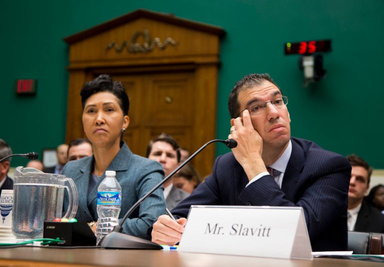 Cheryl Campbell, senior vice president of CGI listens at left as Andy Slavitt, representing QSSI's parent company, testifies on Capitol Hill in Washington, Thursday, Oct. 24, 2013, before the House Energy and Commerce Committee hearing with contractors that built the federal government's health care websites. The contractors responsible for building the troubled Healthcare.gov website say it was the government's responsibility _ not theirs _ to test it and make sure it worked.  (AP Photo/ Evan Vucci)