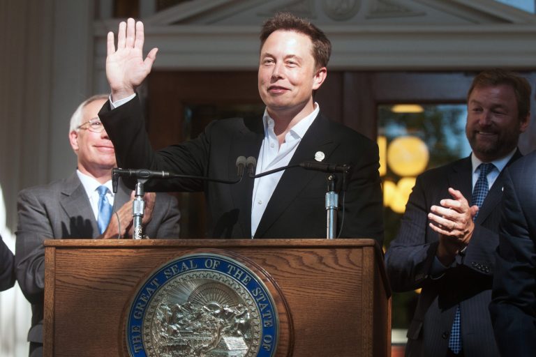 Elon Musk, co-founder and chief executive officer of Tesla Motors Inc., at a news conference at the Nevada State Capitol building in Carson City, Nevada, U.S., on Sept. 4. Tesla will build the world's largest lithium-ion battery plant in Nevada, bringing a $100 billion boost to the state's economy over two decades, Governor Brian Sandoval said. (David Calvert/Bloomberg)