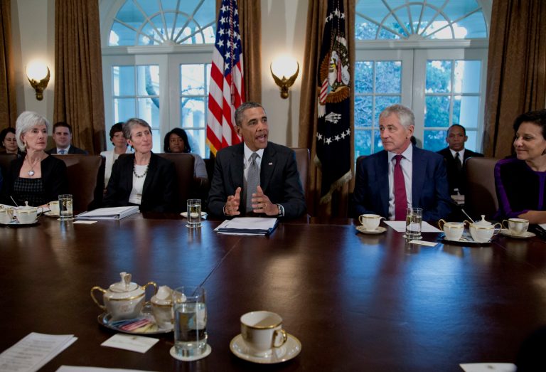President Barack Obama, center, gestures as he speaks to media before his Cabinet meeting, Tuesday, Jan. 14, 2014, in the Cabinet Room of the White House in Washington. From left are, Health and Human Services Secretary Kathleen Sebelius, Interior Secretary Sally Jewell, Defense Secretary Chuck Hagel and Commerce Secretary Penny Pritzker, . (AP Photo/Carolyn Kaster)