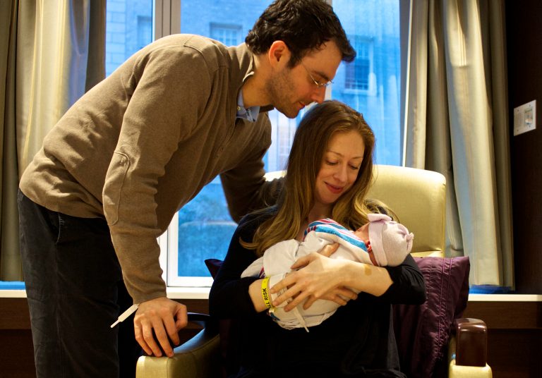 This photo provided by Clinton spokesman Kamyl Bazbaz shows Chelsea Clinton, her husband Marc Mezvinsky, and their daughter Charlotte Clinton Mezvinsky on Saturday, Sept. 27, 2014. Chelsea Clinton announced the news of her daughter's birth on Twitter and Facebook early Saturday, saying she and her husband are 