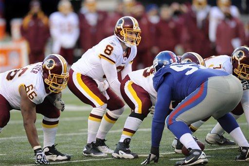 Washington Redskins quarterback Rex Grossman (8) calls signals during the third quarter against the New York Giants, Sunday, Dec. 18, 2011, in East Rutherford, N.J.