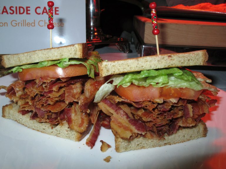 This Monday, Feb. 10. 2014 photo shows a bacon-lettuce-and-tomato sandwich made with an entire pound of bacon at the Tropicana Casino and Resort in Atlantic City, N.J. The casino's Bacon Week festival includes unusual offerings like bacon milk shakes, bacon cupcakes, bacon bloody Marys, beer, vodka and bourbon, and even bacon-flavored toothpaste, dental floss and lip balm. (AP Photo/Wayne Parry)