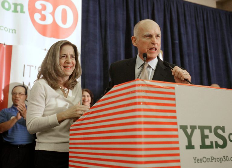   FILE - In this Nov. 6, 2012 file photo, Gov. Jerry Brown and his wife, Anne Gust Brown thank supporters for their work on his temporary tax hike initiative, Proposition 30, during an election night party in Sacramento, Calif. The 74-year-old governor is being treated with radiation for early stage prostate cancer, his office announced Wednesday, Dec. 12, 2012. Brown's 