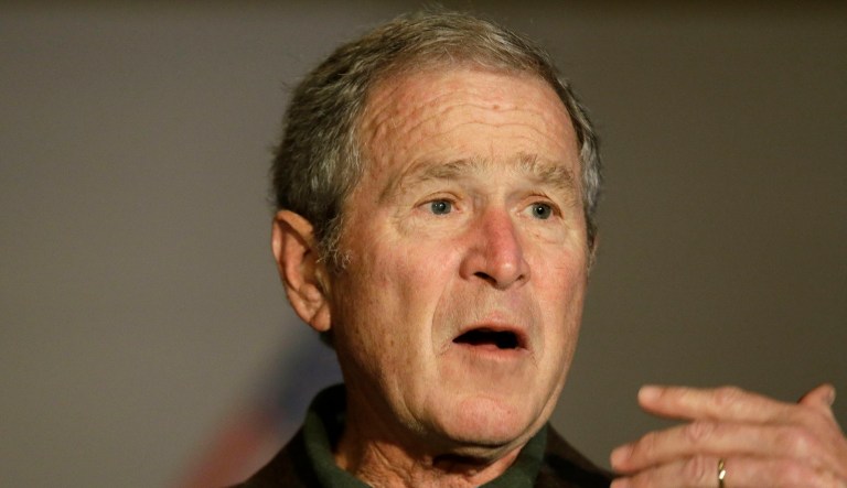 Former president George W. Bush offered words of comfort to the people of Texas on Tuesday while visiting a Southern Methodist University football practice. (AP Photo/LM Otero)