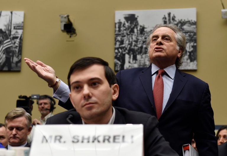 Benjamin Brafman, right, attorney for pharmaceutical chief Martin Shkreli, foreground, speaks on Capitol Hill on Feb. 4 during a House Committee on Oversight and Reform Committee hearing on rising drug prices. Shkreli refused to testify before U.S. lawmakers who excoriated him over severe hikes for a drug sold by a company that he acquired. (AP Photo/Susan Walsh)