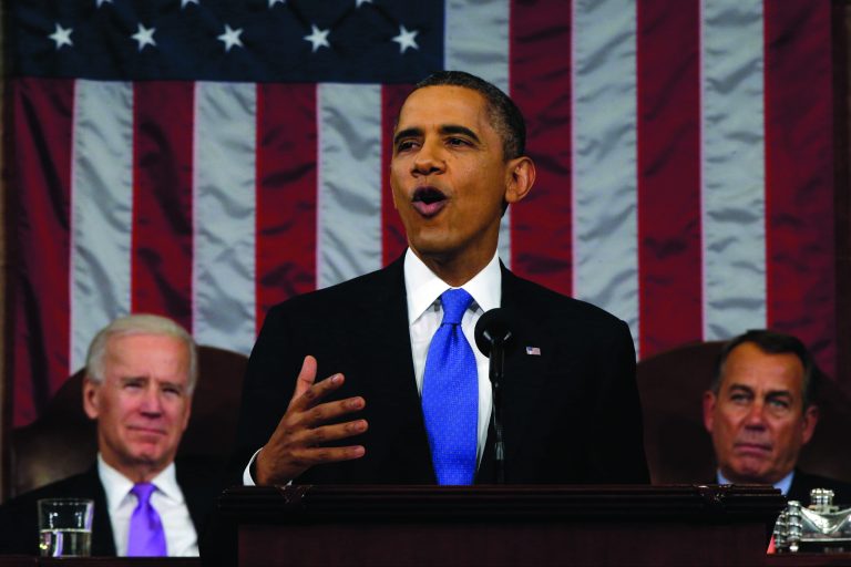 President Barack Obama, flanked by Vice President Joe Biden and House Speaker John Boehner of Ohio, gestures as he gives his State of the Union address during a joint session of Congress on Capitol Hill in Washington, Tuesday Feb. 12, 2013. (AP Photo/Charles Dharapak, Pool)