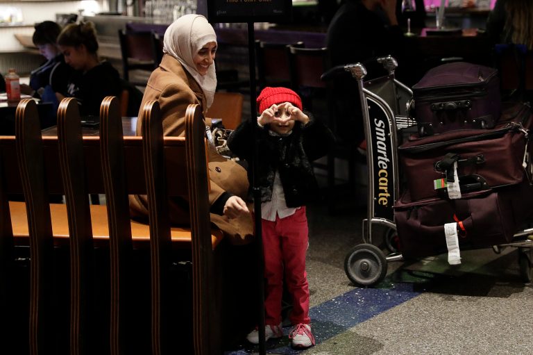 Travelers who have a visa, green-card holders and dual citizens will be exempted. (AP Photo/Jae C. Hong)