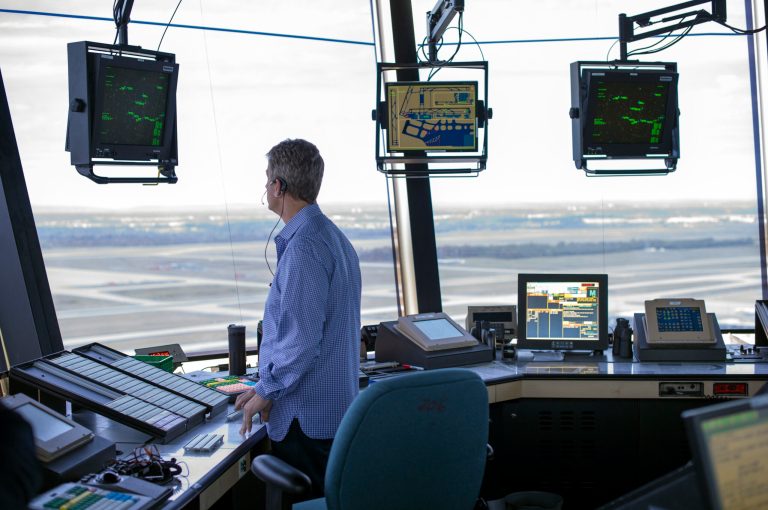 An FAA air traffic controller works in the Dulles International Airport Air Traffic Control Tower in Sterling, Va. President Trump is calling for privatizing the nation's air traffic control operations in his budget proposal, a top priority of the airline industry. The proposal says spinning off air traffic operations from the Federal Aviation Administration and placing them under an 