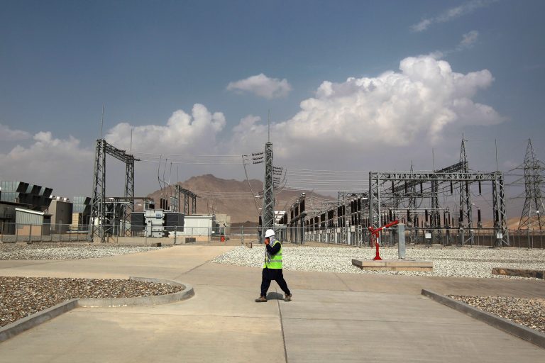A worker walks past electrical transformers at the U.S.-built 105MW Tarakhil Power Plant on September 8, 2011 in Tarakhil, Afghanistan, on the outskirts of Kabul. (Photo by John Moore/Getty Images)