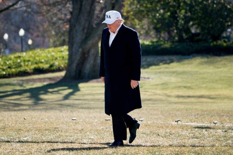 President Donald Trump walks across the South Lawn as he arrives at the White House in Washington, Sunday, Jan. 7, 2018, after traveling from Camp David, Md. (AP Photo/Andrew Harnik)