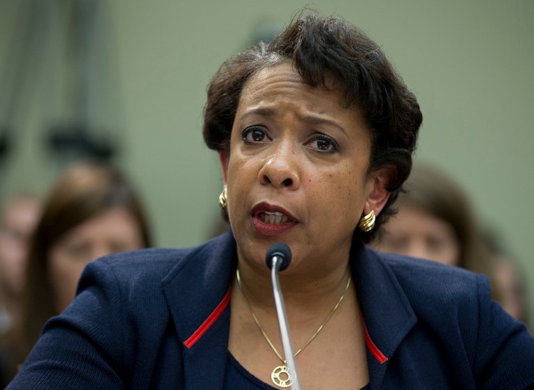 —œYou have truly outlined the issue of the day facing our nation ... We have to have the difficult conversations about race and policing in this country,—£ Loretta Lynch said. (AP Photo)