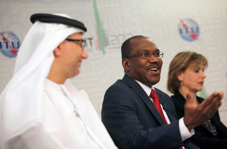   Hamdoun Toure, Secretary General of International Telecommunication Union, ITU, middle, speaks to journalists on the final day of the World Conference on International Telecommunications in Dubai, United Arab Emirates, Friday Dec. 14, 2012. Envoys in Dubai signed a new U.N. telecommunications treaty Friday that a U.S.-led delegation says endorses greater government control of the Internet. The U.S. and more than 20 other countries refused to ratify the accord by the 193-nation International Telecommunications Union.(AP Photo/Kamran Jebreili)  