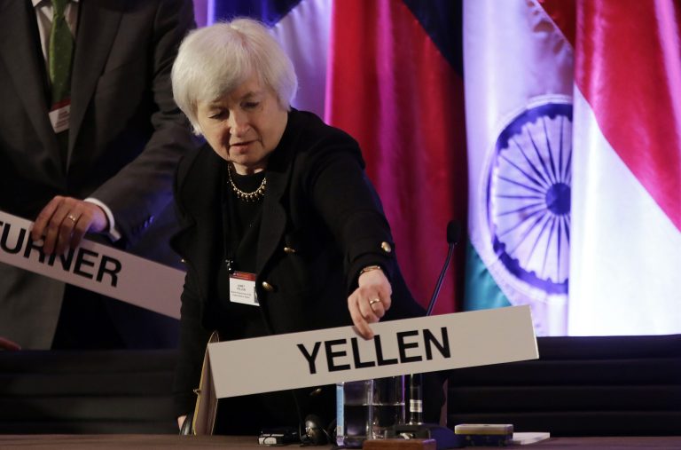 FILE - In this  Monday, June 3, 2013, file photo, Janet Yellen, vice chair of the Board of Governors of the Federal Reserve System, places her name plate at her seat at the International Monetary Conference in Shanghai, China. Janet Yellen is expected to face skepticism at a hearing Thursday, Nov. 13, 2013, on her nomination to lead the Federal Reserve from Republicans who say the Fed's policies may be swelling asset bubbles or raising the risk of high inflation.   (AP Photo/Eugene Hoshiko, File)