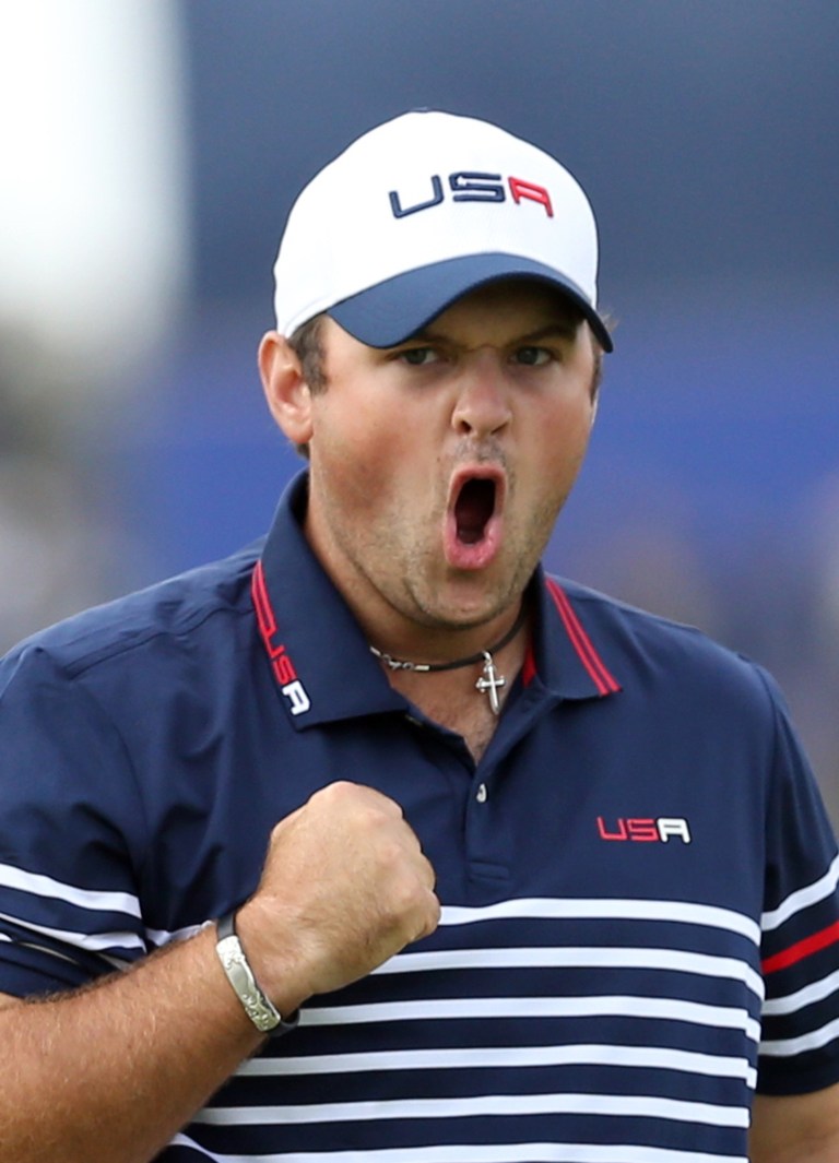Patrick Reed of the US celebrates his birdie and winning the 8th hole during the singles match on the final day of the Ryder Cup golf tournament, at Gleneagles, Scotland, Sunday, Sept. 28, 2014. (AP Photo/Peter Morrison)