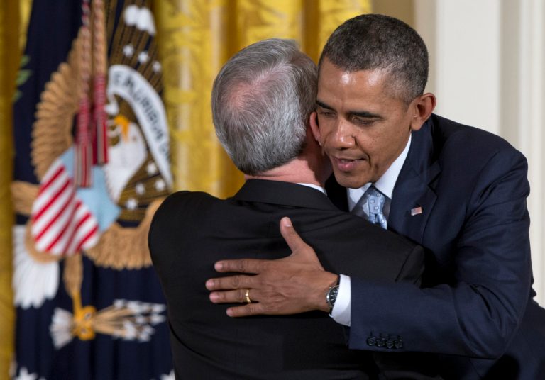President Obama embraces Joel C. Hunter, senior pastor of Northland, A Church Distributed, in Longwood, Fla., during the Easter Prayer Breakfast, Monday, April 14, 2014, in the East Room of the White House in Washington. (AP Photo/Carolyn Kaster)