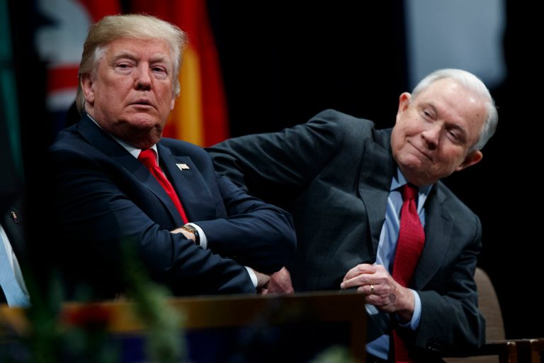President Donald Trump sits with Attorney General Jeff Sessions during the FBI National Academy graduation ceremony, Friday, Dec. 15, 2017, in Quantico, Va. (AP Photo/Evan Vucci)