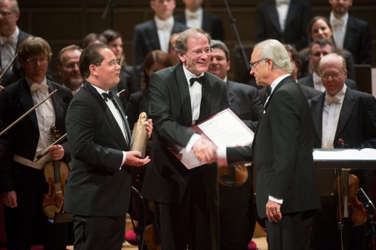 Andreas Grossbauer, left, of the Vienna Philharmonic Orchestra, and his precursor as chairman and present archivist, Clemens Hellsberg, center, shakes hands with Swedish King Carl XVI Gustaf at the Concert Hall in Stockholm, Sweden, Wednesday Oct. 8, 2014, during a ceremony in memory of legendary soprano Birgit Nilsson. The Vienna Philharmonic Orchestra has been awarded the Birgit Nilsson Dollars 1 million Prize for 2014. (AP Photo/TT News Agency, Fredrik Sandberg) SWEDEN OUT